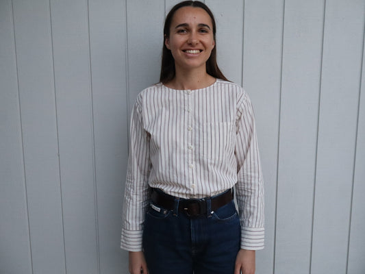 Woman wearing The Celeste shirt by Laurie Milligan. A striped 100% cotton shirt made in New Zealand.