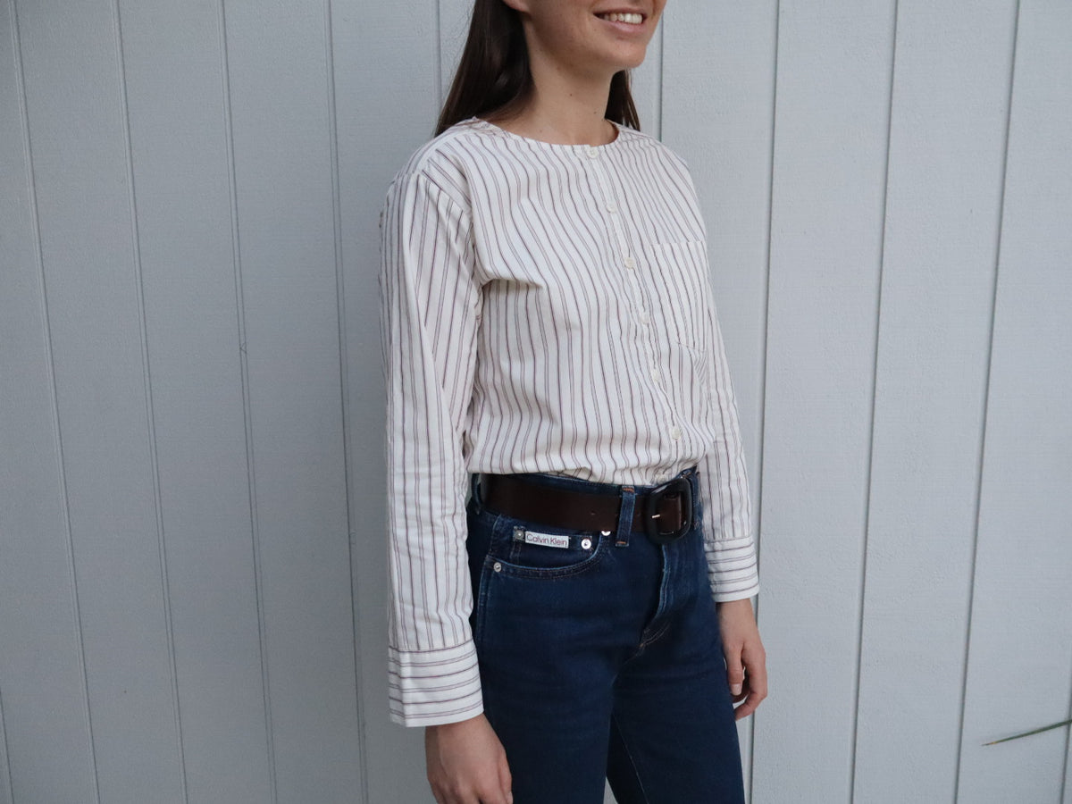 Woman wearing The Celeste shirt by Laurie Milligan. A 100% cotton stripe shirt made in New Zealand. 